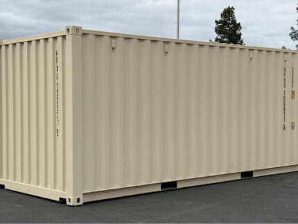 Brand new 20ft beige shipping container side view in storage yard - Australia Wide Container Pty Ltd