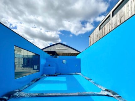 Interior basin of a 40ft container pool with blue liner